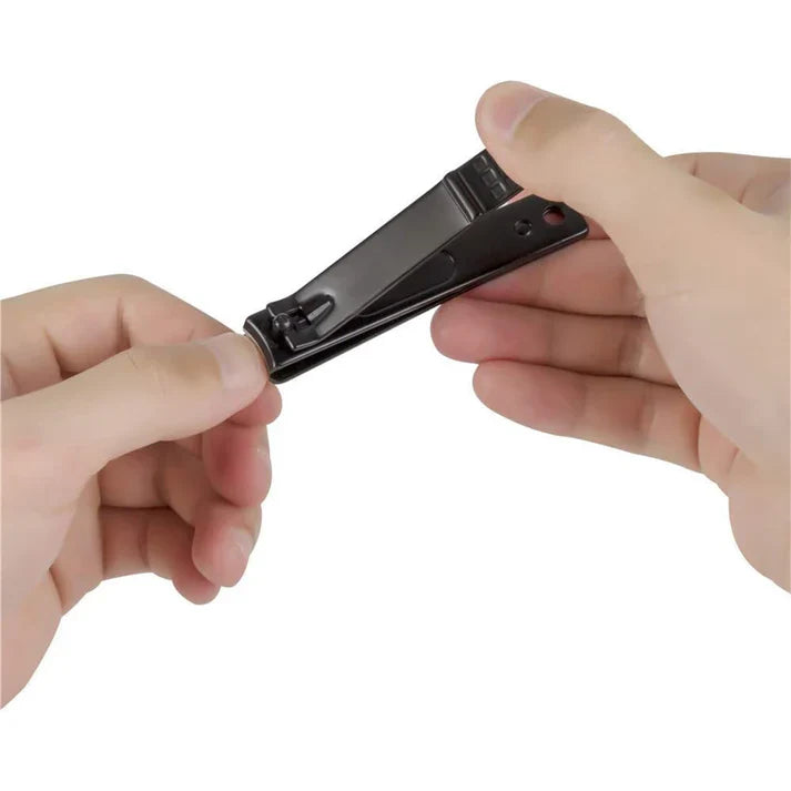 Person holding the Zeyla Precision Nail Clipper for a clean nail grooming experience.